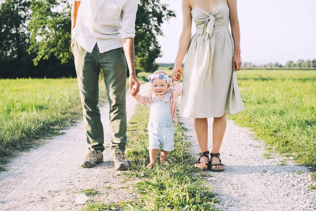 couple with a baby in nature