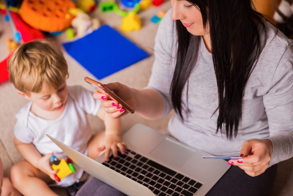 woman shopping baby clothes online