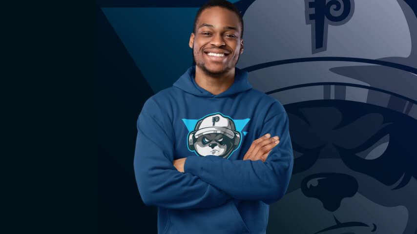 A man wears a dark blue hoodie with a dog illustration in the center.