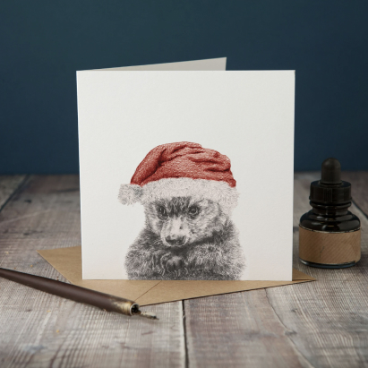 Cute personalized Christmas card with an animal illustration.
