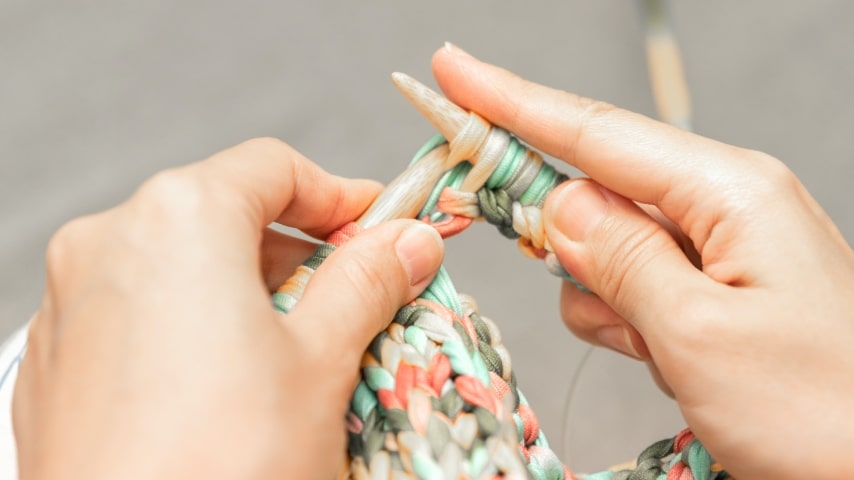 A photo of someone knitting.