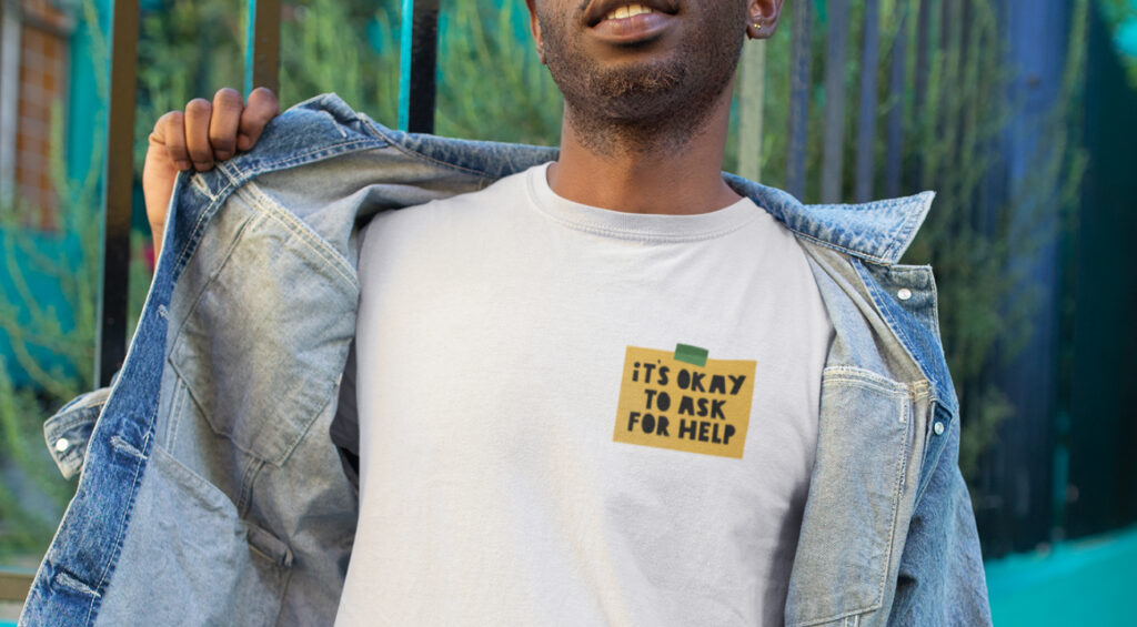 A man in a t-shirt displaying the phrase 