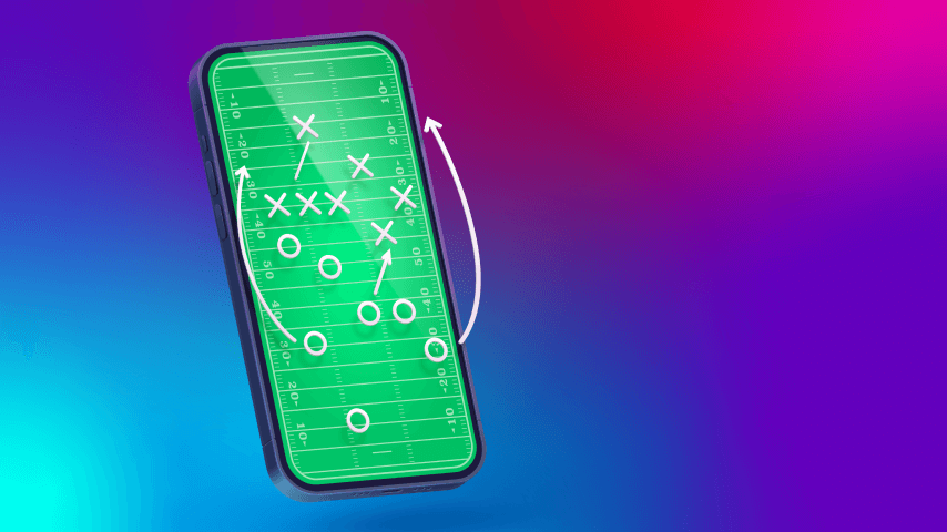 A phone showing a football game scheme on the screen.