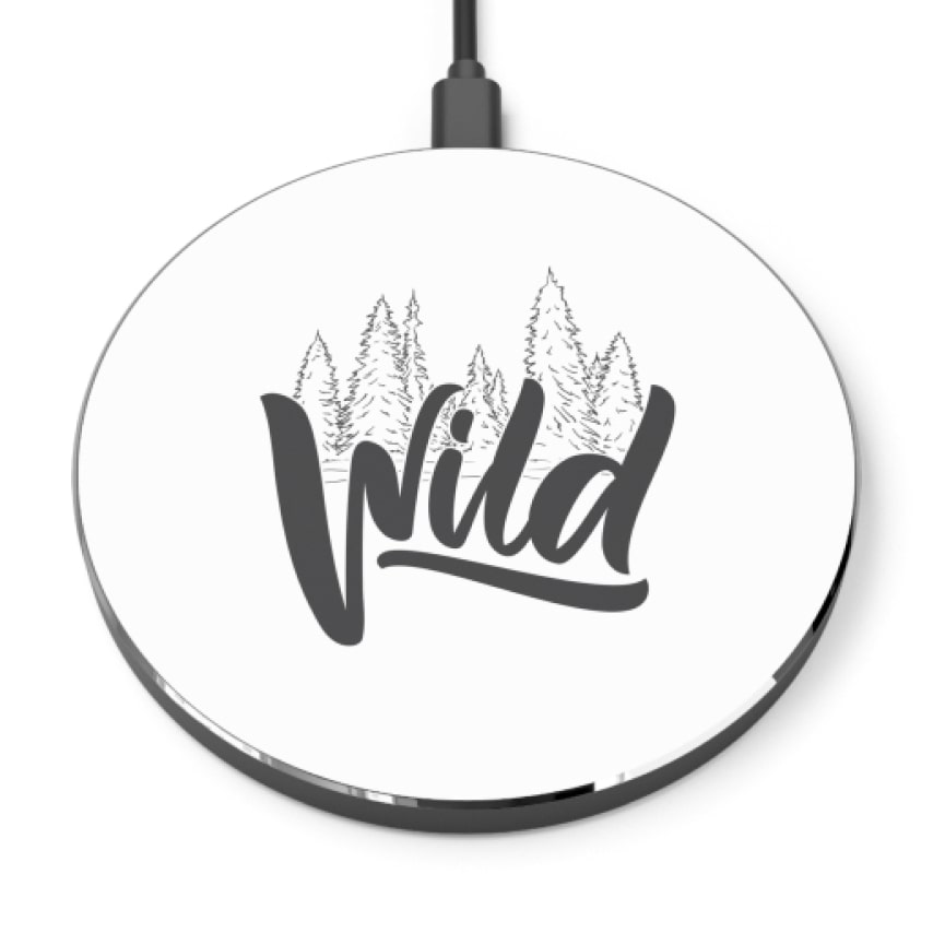 A white phone charger with the word "Wild" on it and tree outlines.