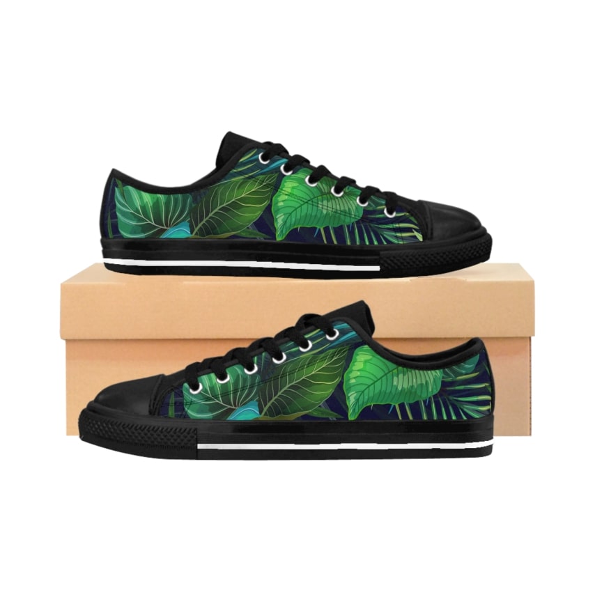 A pair of black sneakers with a tropical pattern.
