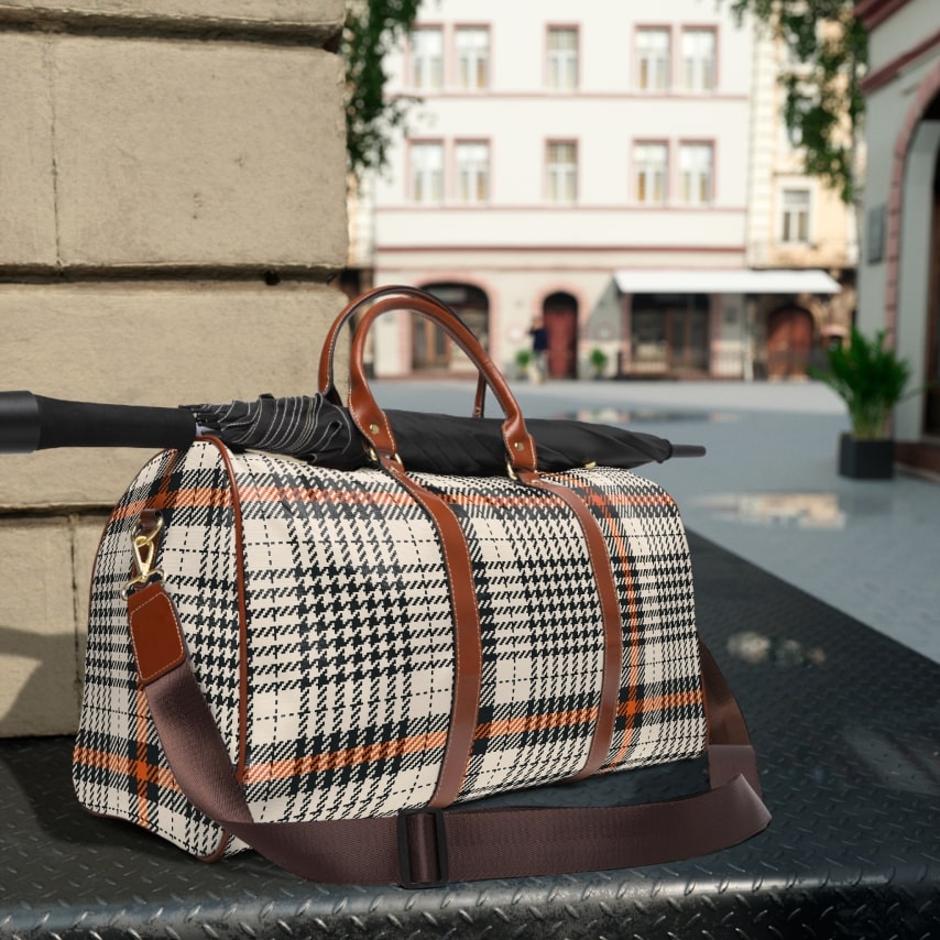 A brown and white travel bag with a plaid tartan pattern.
