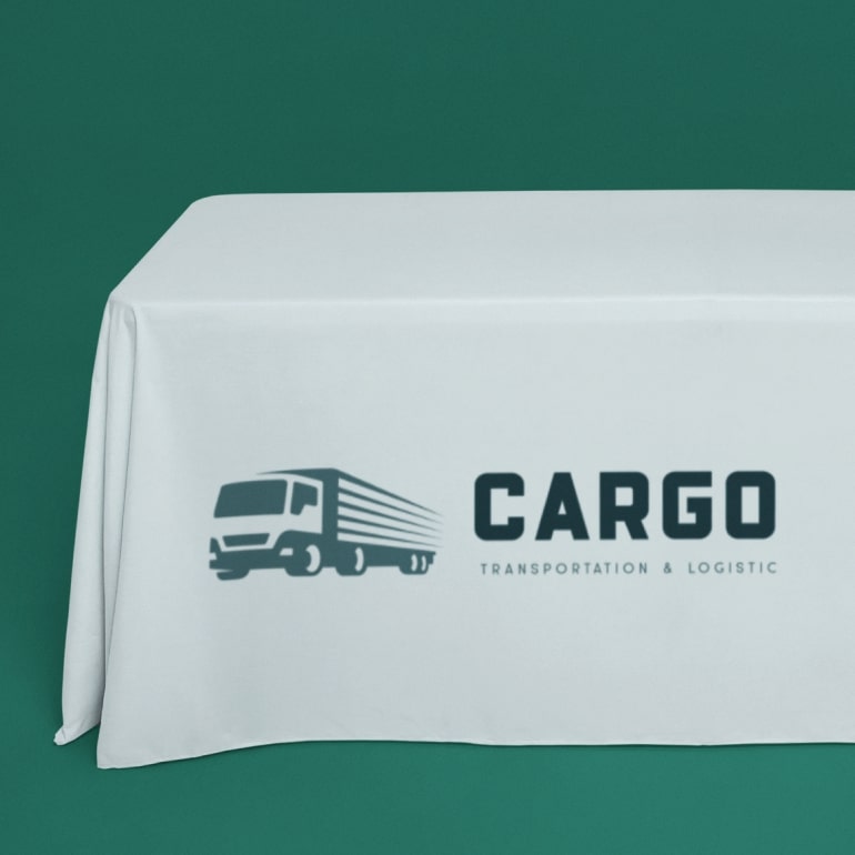 Mint green table cover with a company logo.