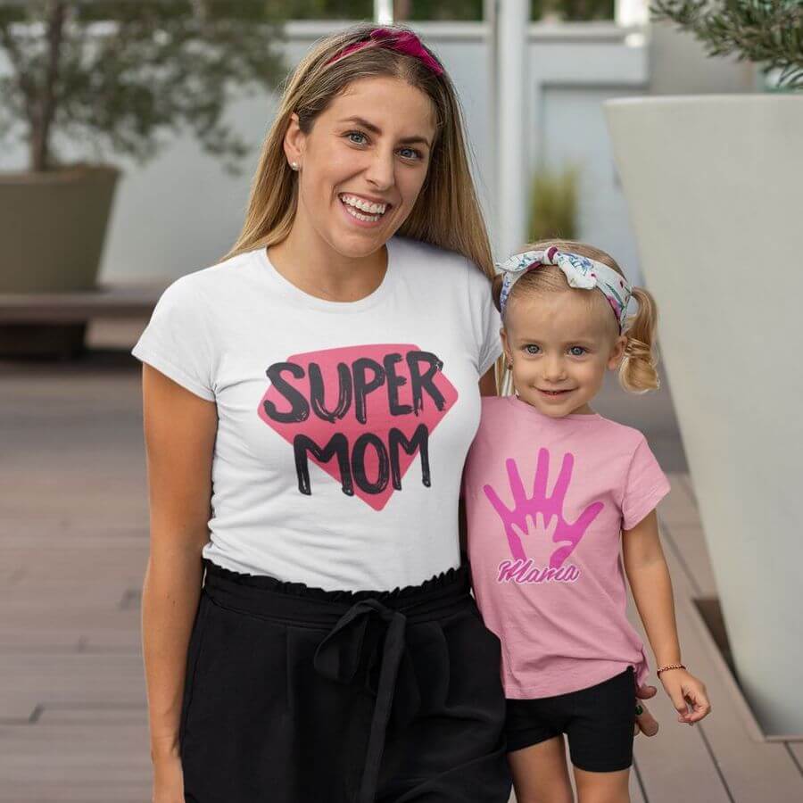 Mom with her daughter posing in custom t-shirts, hers says "Super Mom"