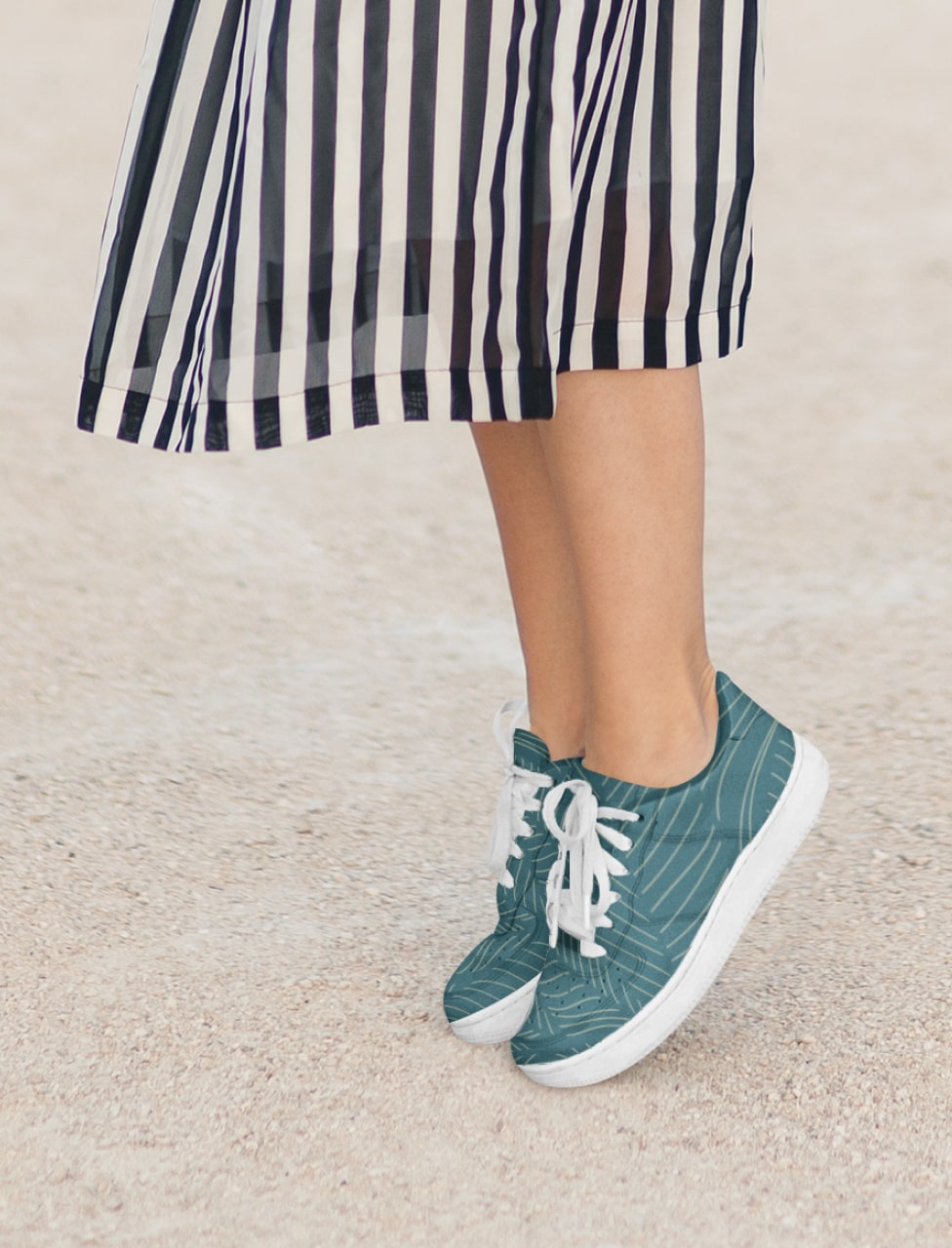 A cropped image of a woman wearing a pair of custom sneakers.