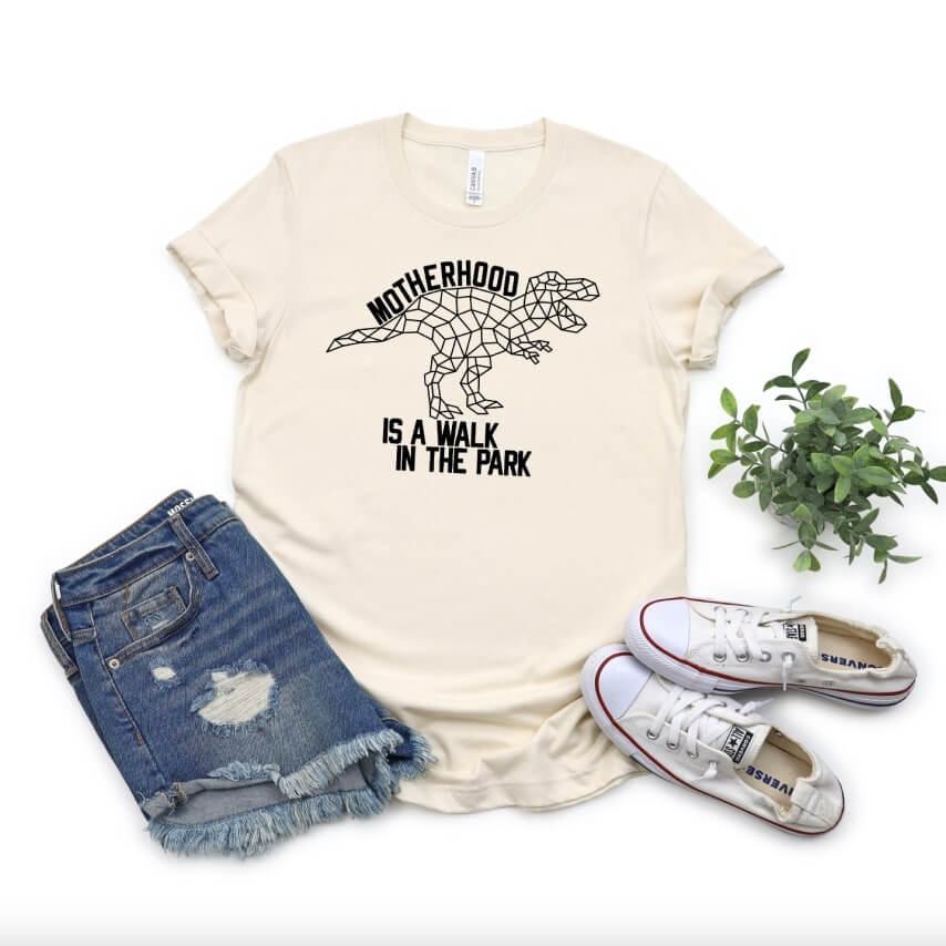 Mother's Day t-shirt with a dinosaur design that says "Mothehood is a walk in the park."
