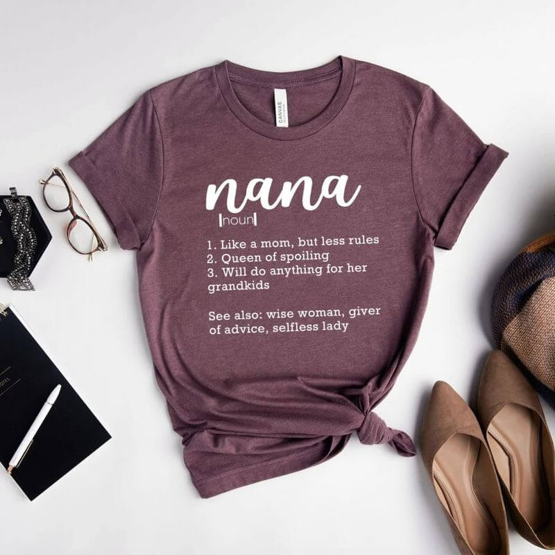 Displayed outfit with a red shirt that has a clever definition of a nana printed on it