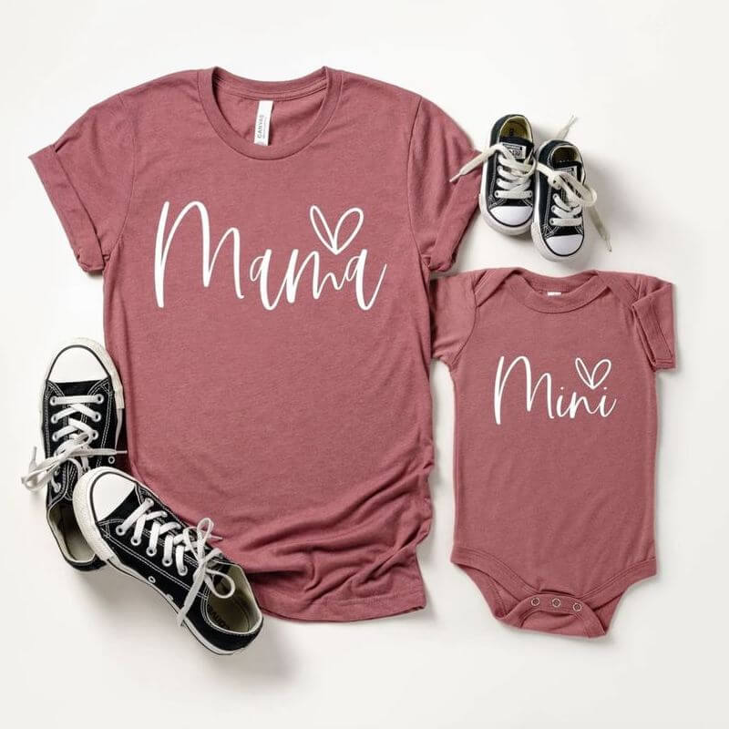 A matching set of a t-shirt and baby bodysuit that say "Mama" and "Mini"