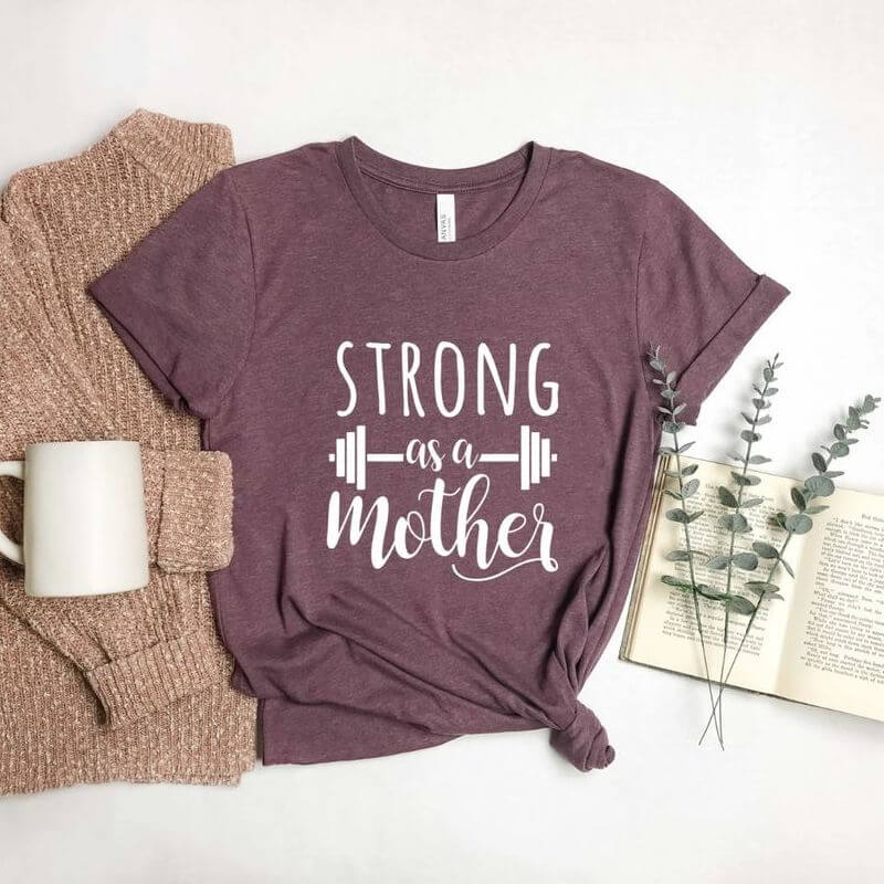 Red t-shirt that says "Strong as a mother"