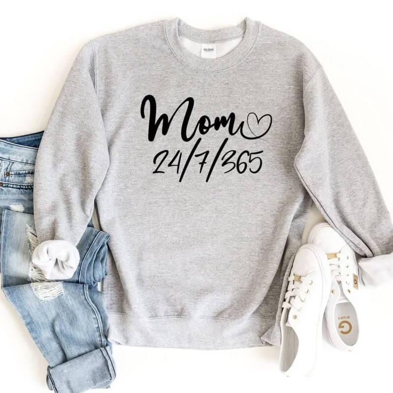 Displayed outfit with a grey sweatshirt that says "Mom 24/7/365"