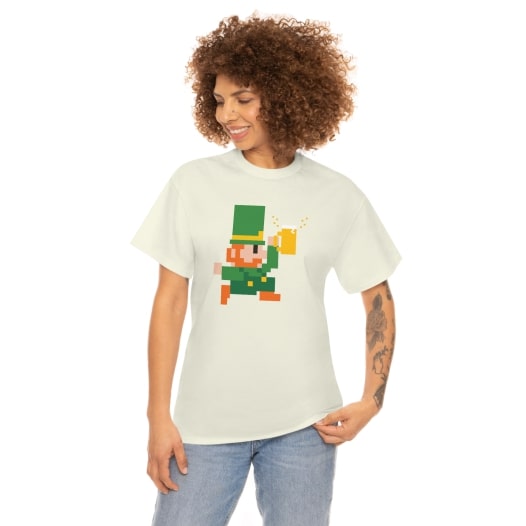 Cotton tee in the colour “Natural” with a pixelated leprechaun design on the front.