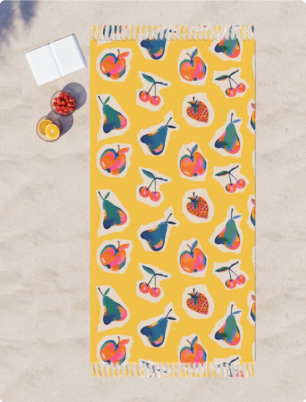 Yellow beach towel with a pattern of different fruits and berries.