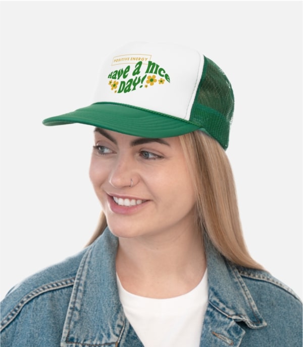 A woman wearing a custom trucker hat with custom text.