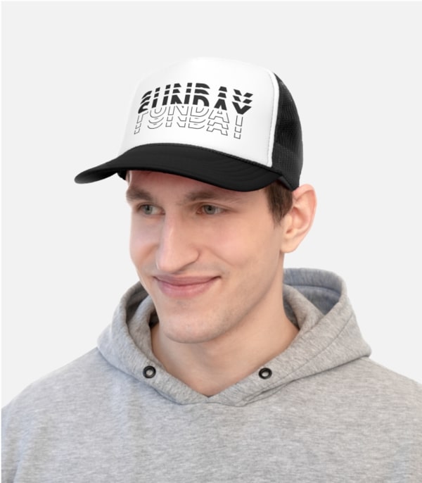 A man wearing a custom trucket hat with illustrated text.