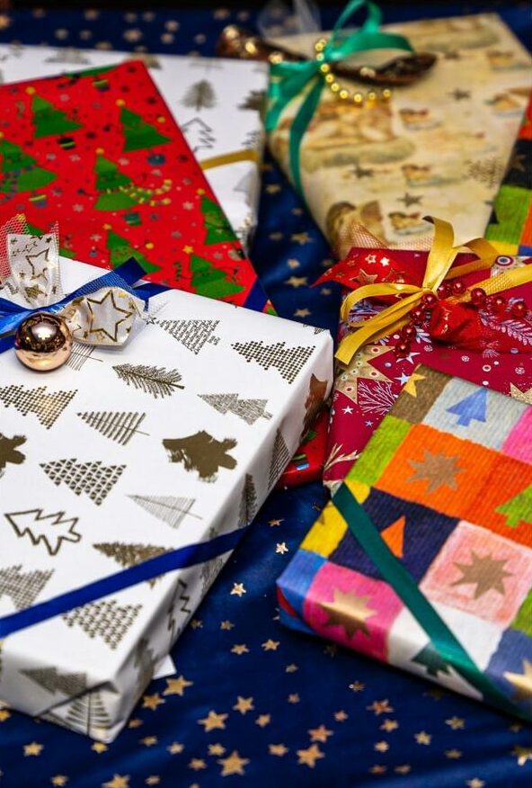 An image of a bundle of gifts wrapped in custom wrapping paper.