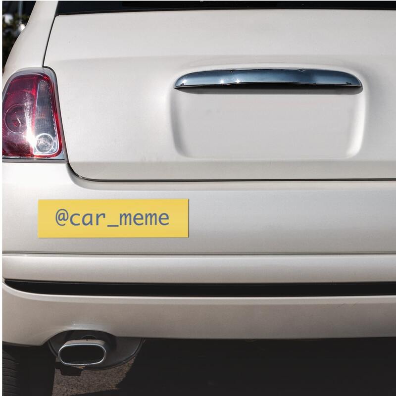 Car with a simple rear bumper sticker showing an instagram user account "@car_meme".