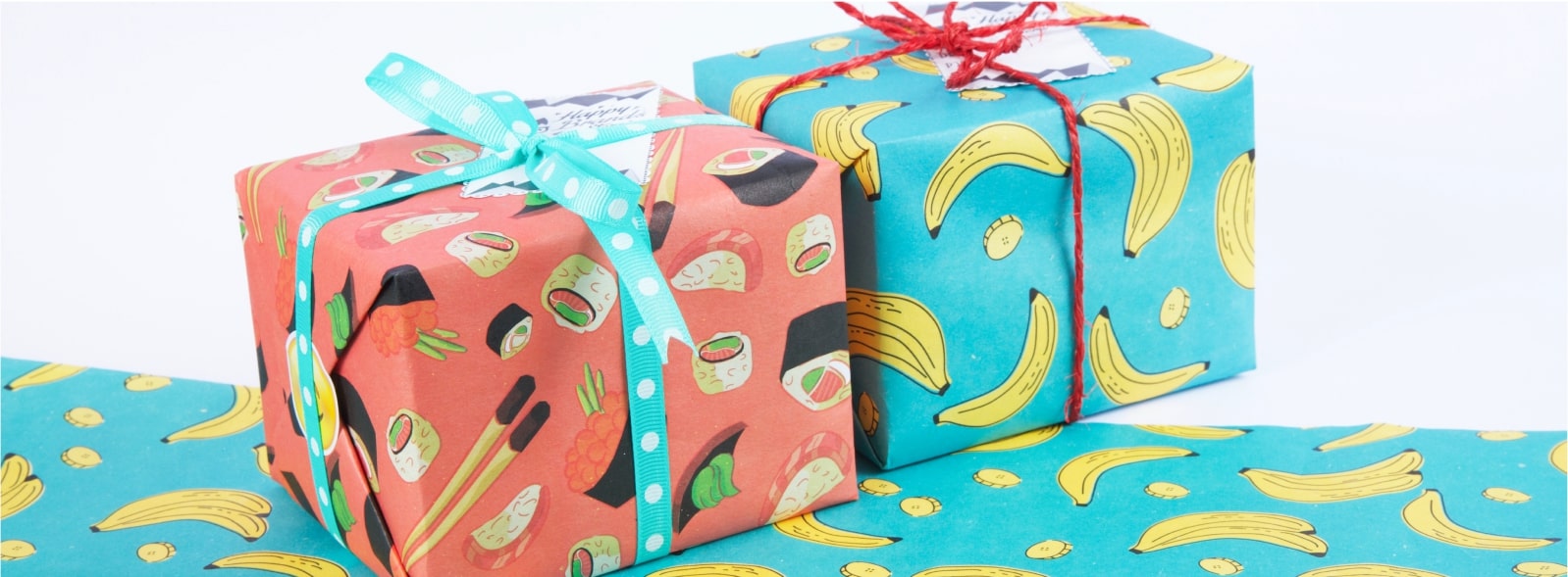 A mockup image of two gifts wrapped in custom wrapping paper.
