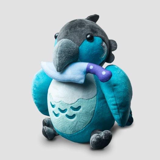 A plushie of a blue parrot with a knife in its mouth.