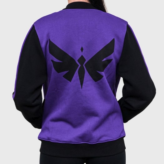 A black and purple varsity jacket with a winged symbol printed on the back.