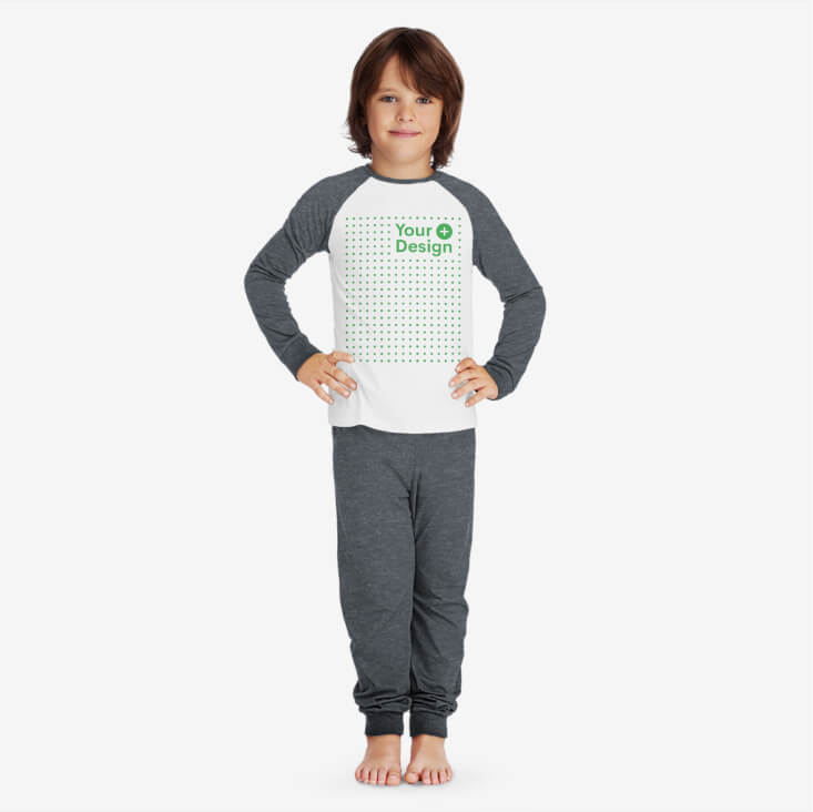 Grey and white kids' pajama set with the “Your design here” sign on the front of the shirt.