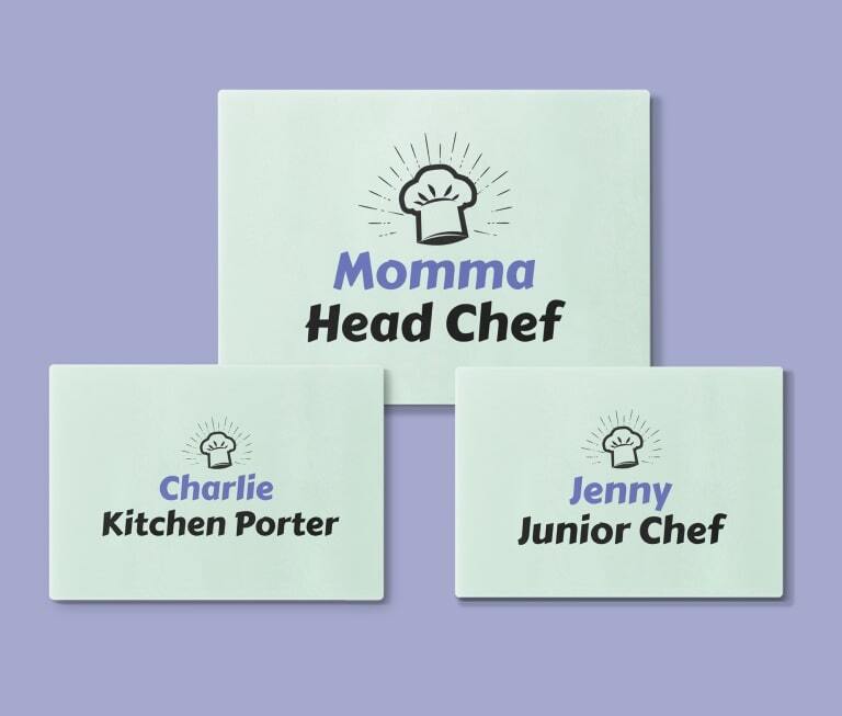 Three personalized cutting boards that say "Momma Head Chef", "Charlie Kitchen Porter", and "Jenny Junior Chef"