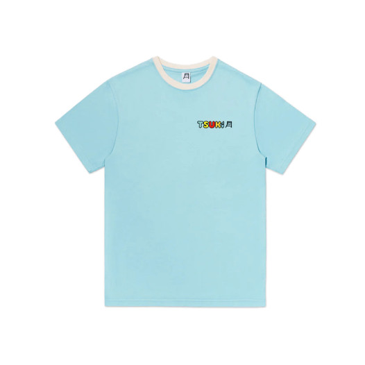 A light blue t-shirt with the brand name “Tsuki” on the left chest print area.