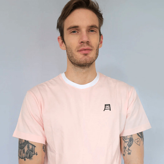 PewDiePie wearing a pink t-shirt with his brand logo on the left chest print area.