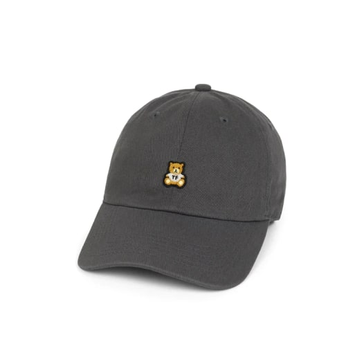 A gray cap with a tiny teddy bear embroidered on the front.