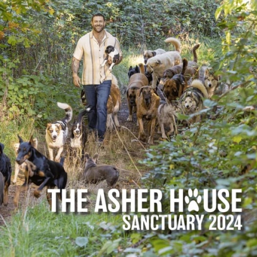 The Asher House Sanctuary Calendar 2024 with a man and a group of dogs on the cover.