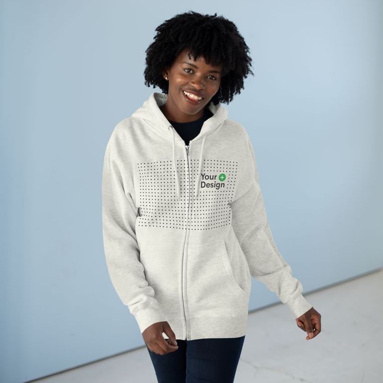 Woman wearing a white zip-up hoodie with the “Add your design” sign on the front.