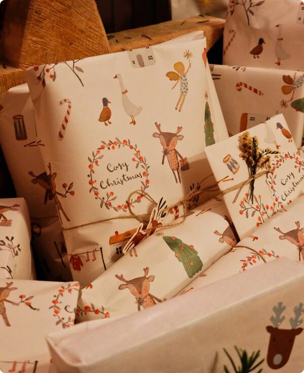 An image of a set of gifts wrapped in custom wrapping paper.