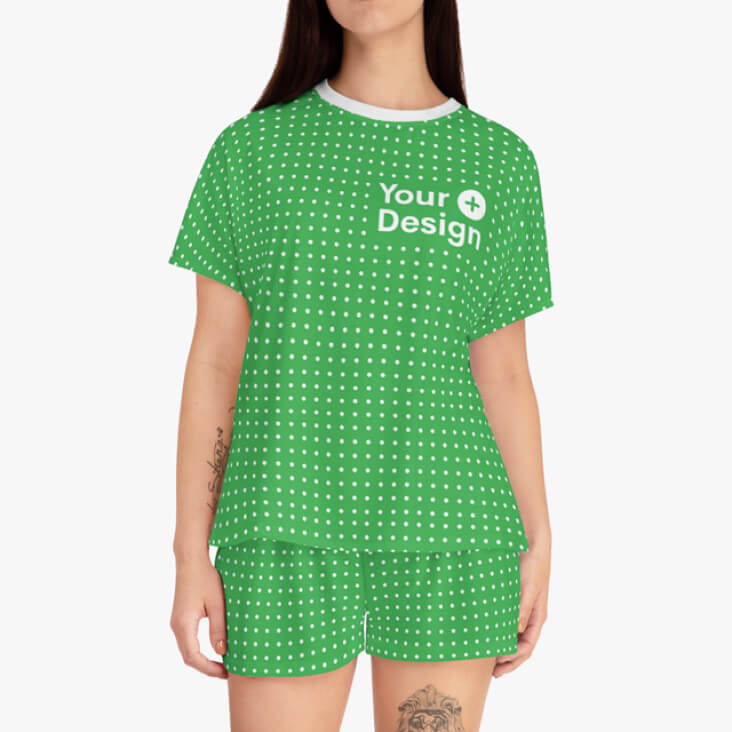All-over-print women's pajama shorts and a shirt with the “Your design here” sign.