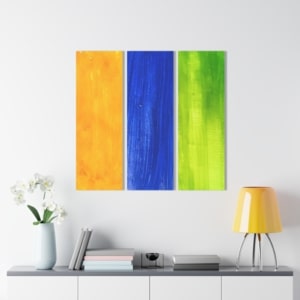 Acrylic print in the style of a triptych displaying yellow, green, and blue lines of abstract art.