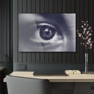 Horizontal acrylic print of an image of an eye comprised solely out of black dots in various sizes.
