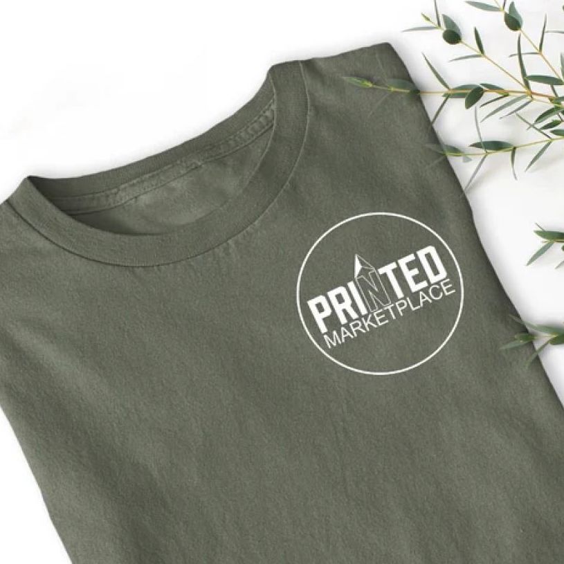 A neatly folded t-shirt in olive green color with a round logo graphic on the left side of the chest.