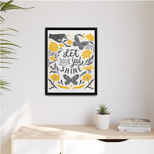 An image of a custom framed canvas with text and abstract illustrations in black and yellow.