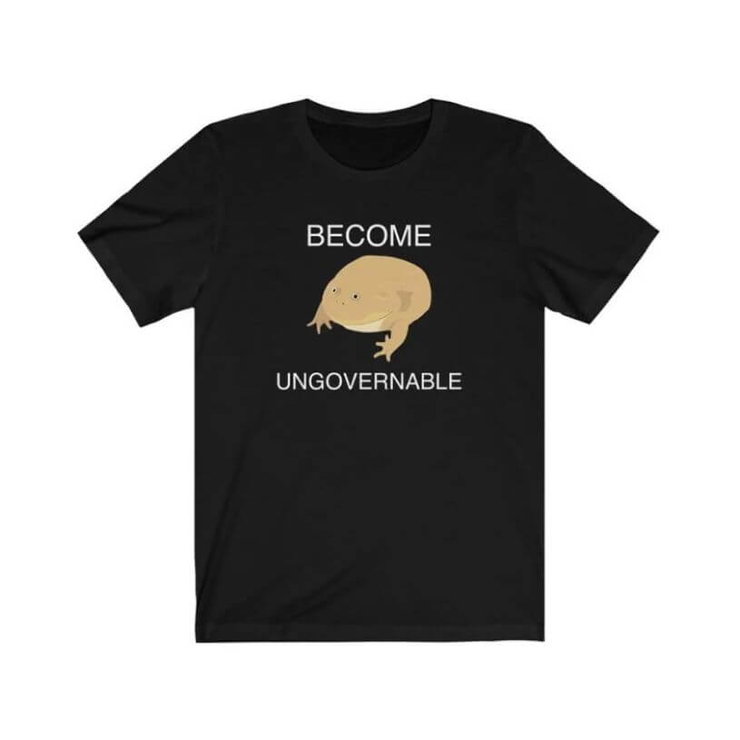 Black t-shirt with a drawing of a very fat toad with text on top and below it that says, “become ungovernable.”