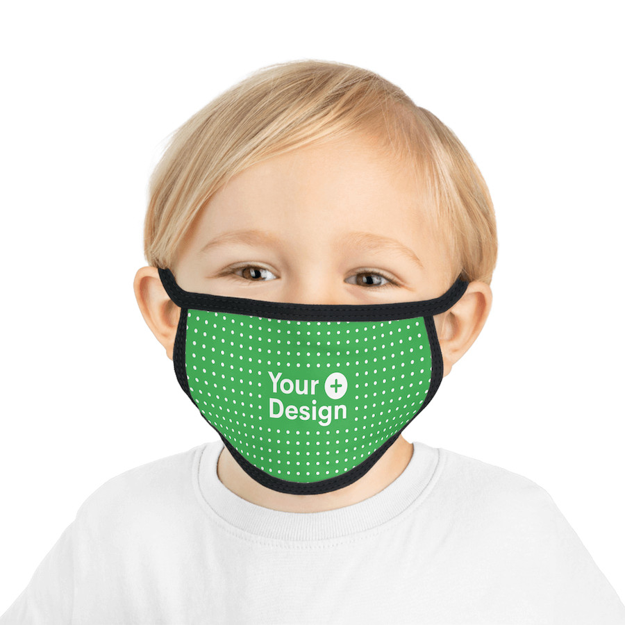 A kid posing in a white t-shirt and custom face mask that says "Your Design"