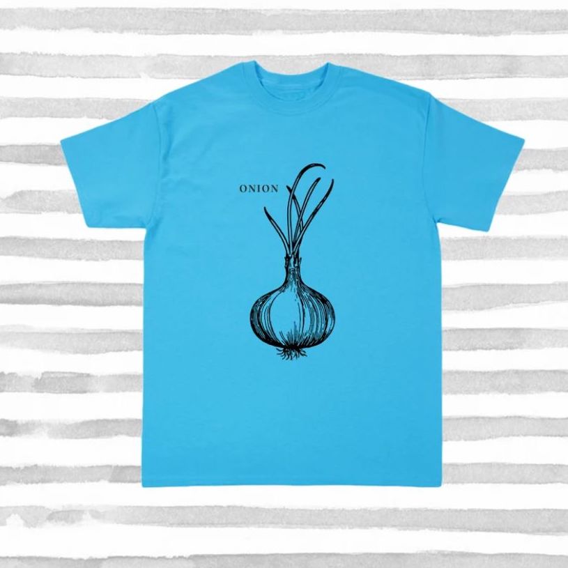 A bright blue t-shirt with a drawing of an onion and text that says “Onion” on top.