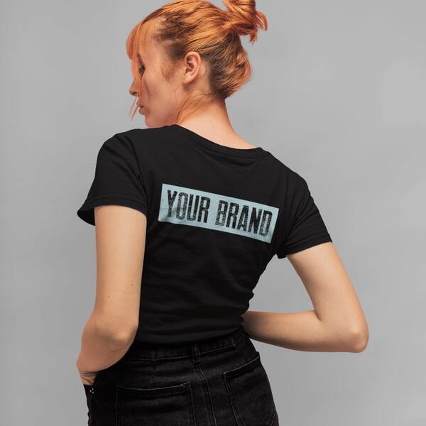 Woman wearing a black t-shirt with a “Your Brand” logo placeholder on the back.