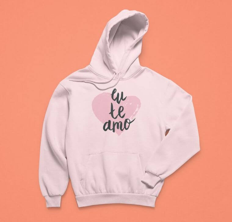 A custom pink hoodie that says “eu te amo” and has an image of a heart