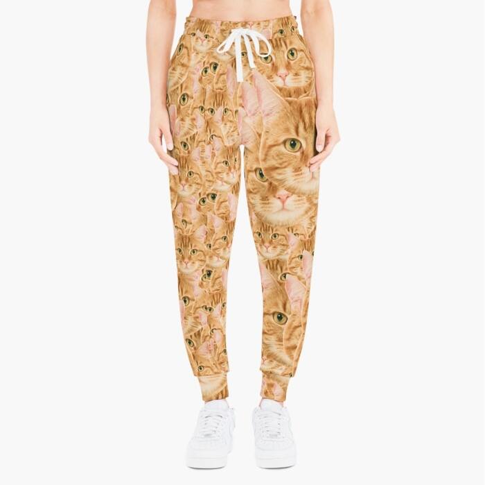 A mockup image of personalized sweatpants with a cat print.