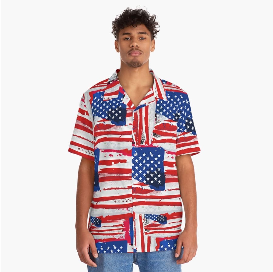 Model posing in a custom all-over-print hawaiian shirt printed with stylized American flag patterns.