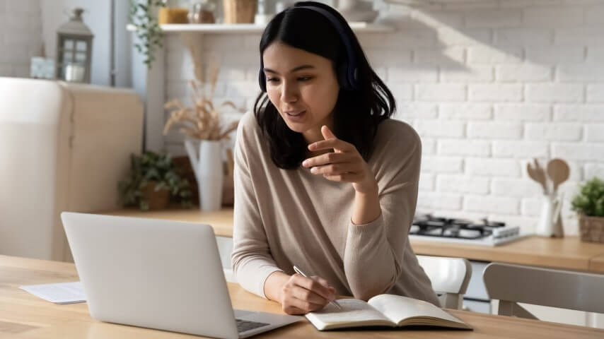 Woman working from her home as a virtual assistant.