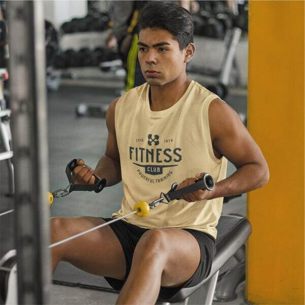 An image of a man working out while wearing a personalized team shirt with a logo in front.