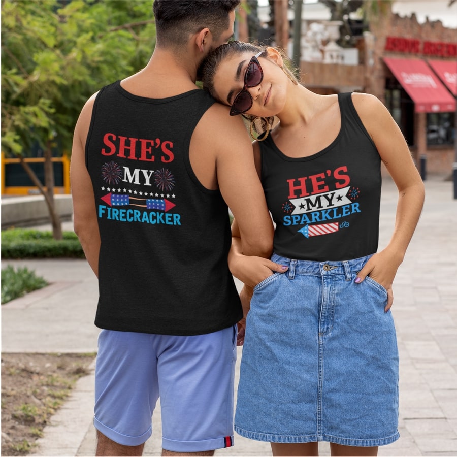 Couple wearing custom tank tops with texts “She’s my firecracker” and “He’s my sparkler” printed on the back and front.